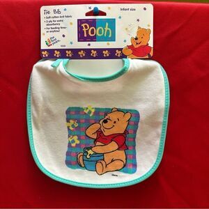 The First years Pooh Tie Bib infant